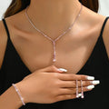 Bridal jewellery set with rhinestone heart necklace, elastic bracelet, and matching earrings with tassel details