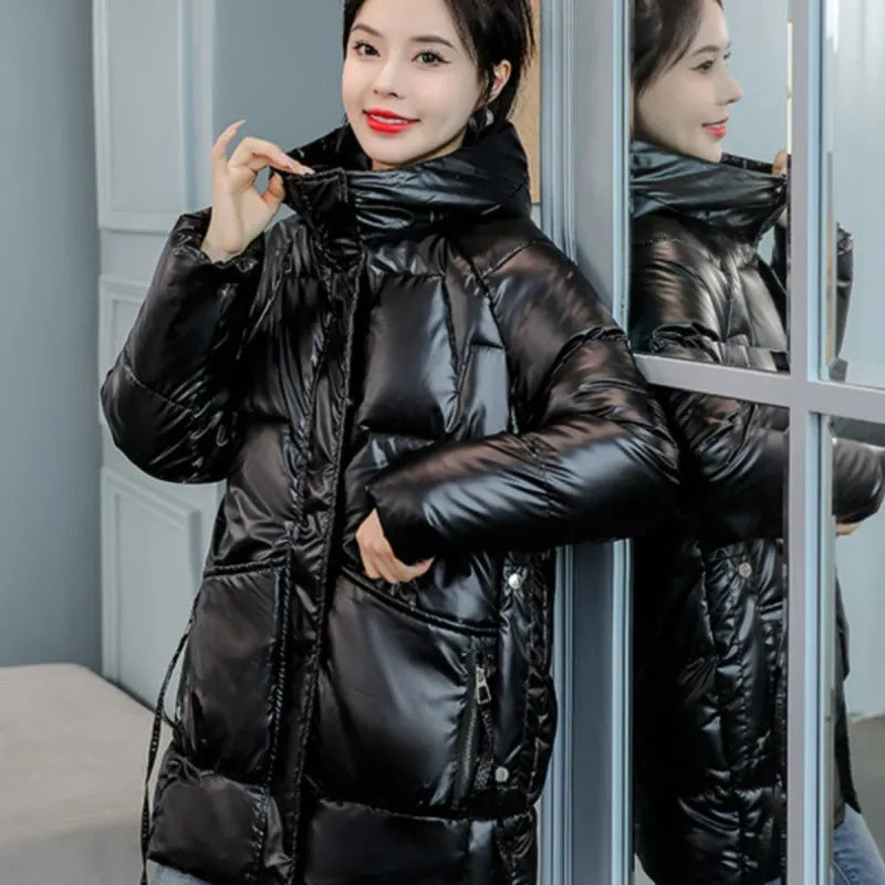 Women's loose thick hooded winter jacket in black, shown on a hanger.