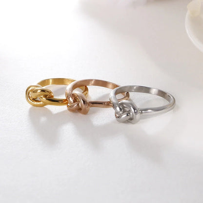Truelove Knot Geometric Titanium Steel Ring in gold and rose gold finishes