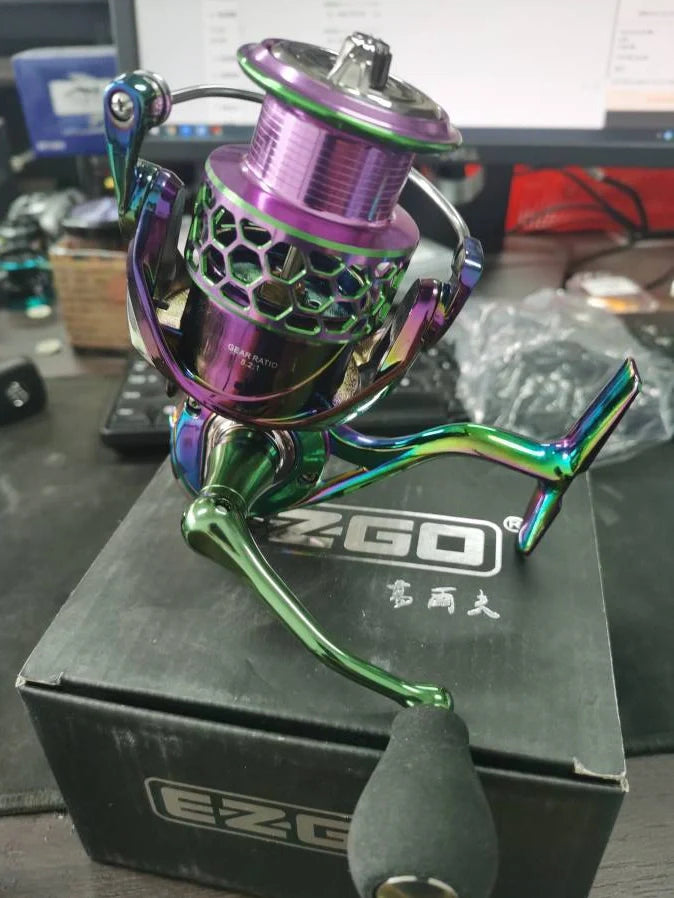 All-metal spinning fishing reel with stainless steel bearings for saltwater use, showing interchangeable handle