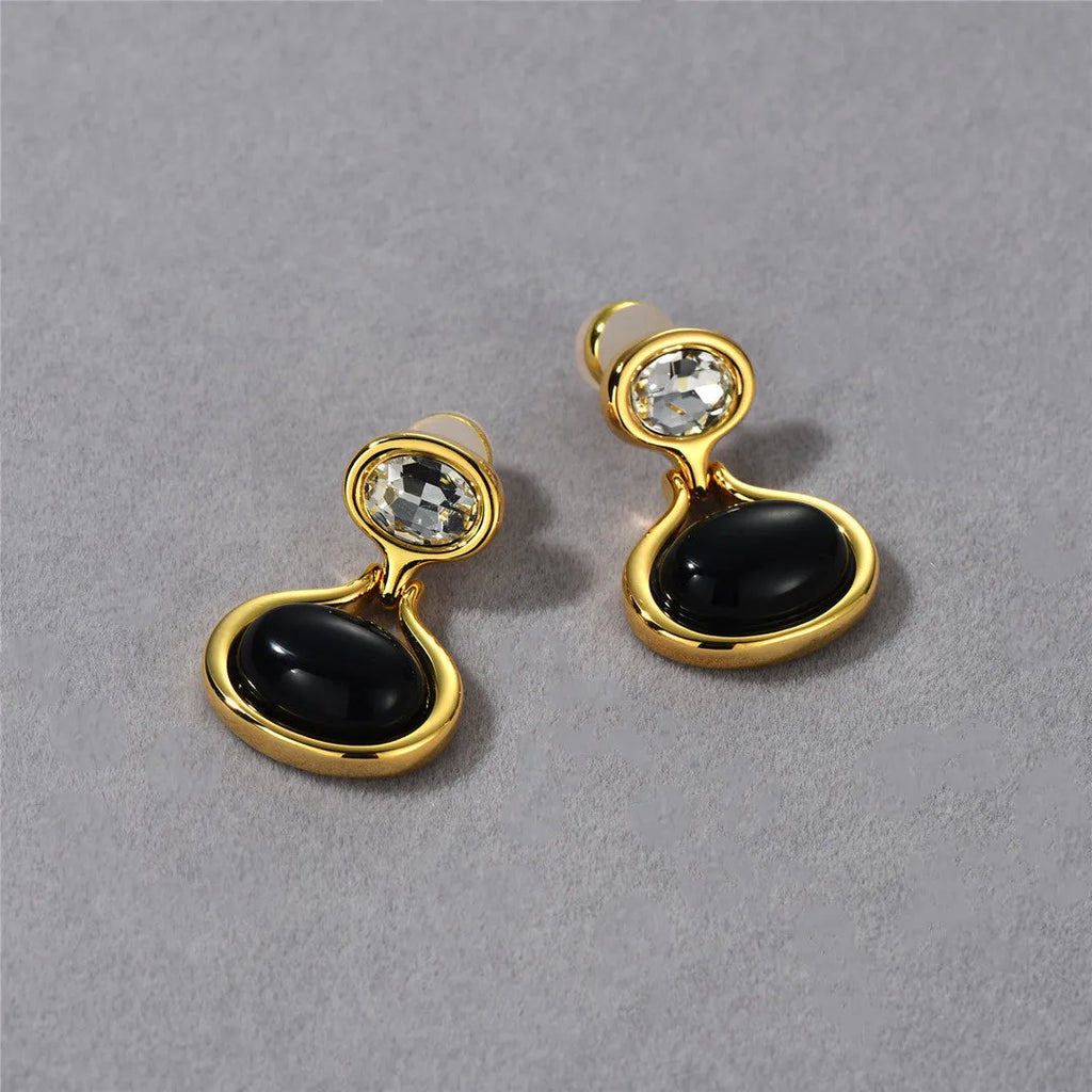 Pair of 18K gold-plated geometric earrings with black onyx and diamonds, 28mm x 18.5mm, gold colour