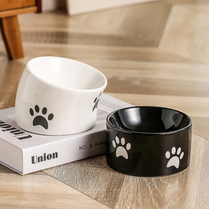 Ceramic cat bowl with slanted mouth design showing cat's paw pattern in yellow colour