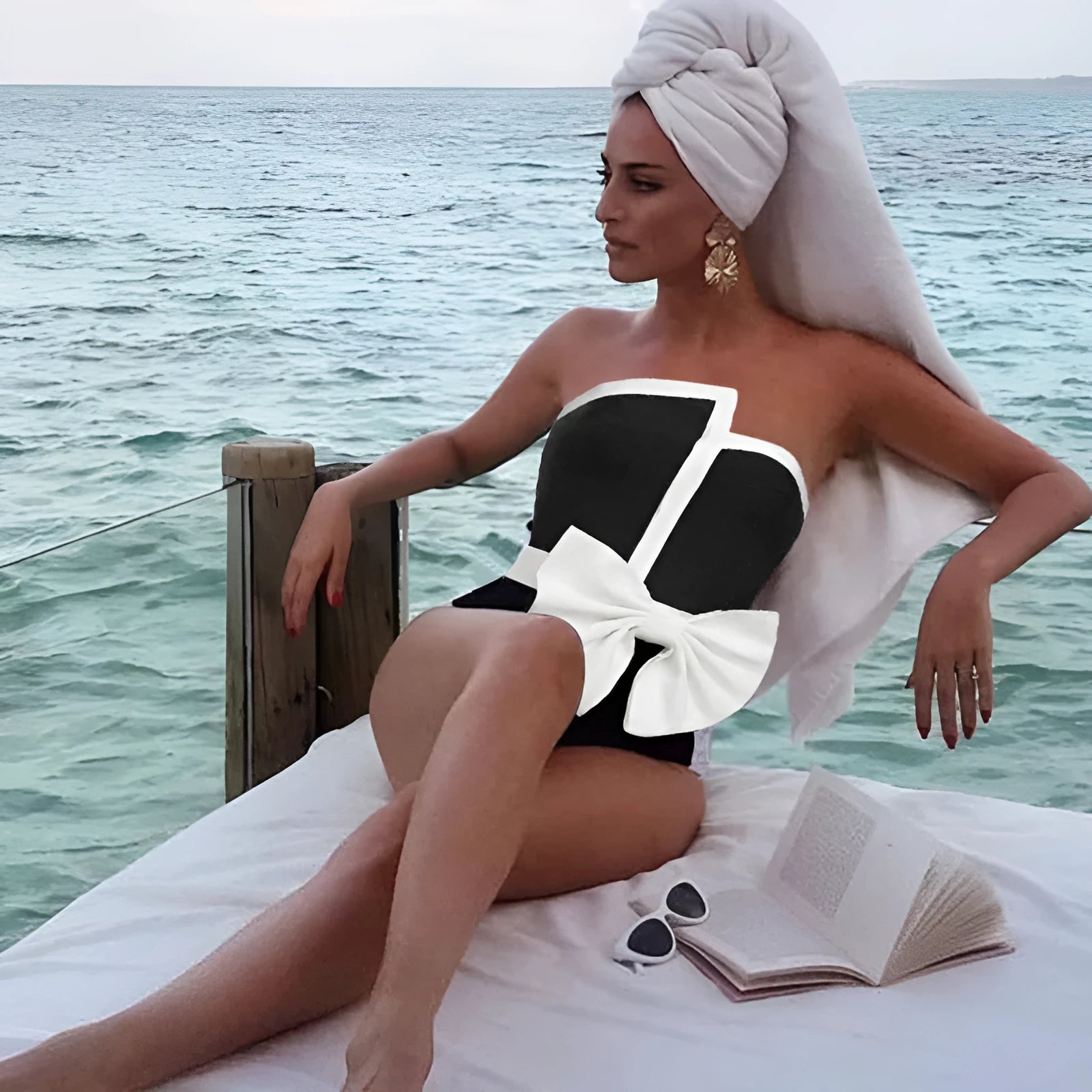 Women's black and white colour-block one-piece swimsuit with asymmetric bow and irregular tube top