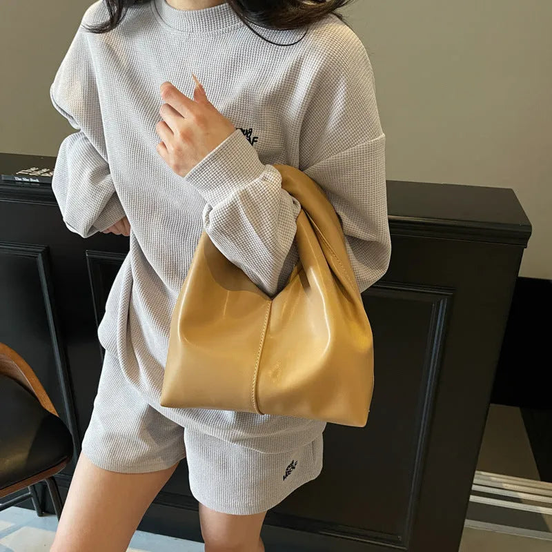 Women's casual dumpling-shaped PU leather shoulder bag in seven colours with mobile phone compartment