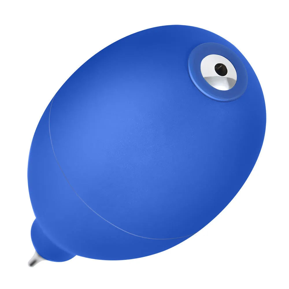 Blue rubber dust removal air blower cleaning tool shown next to a mobile phone.
