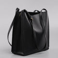 Brown genuine leather women's bucket handbag with double shoulder straps and interior organisation pockets