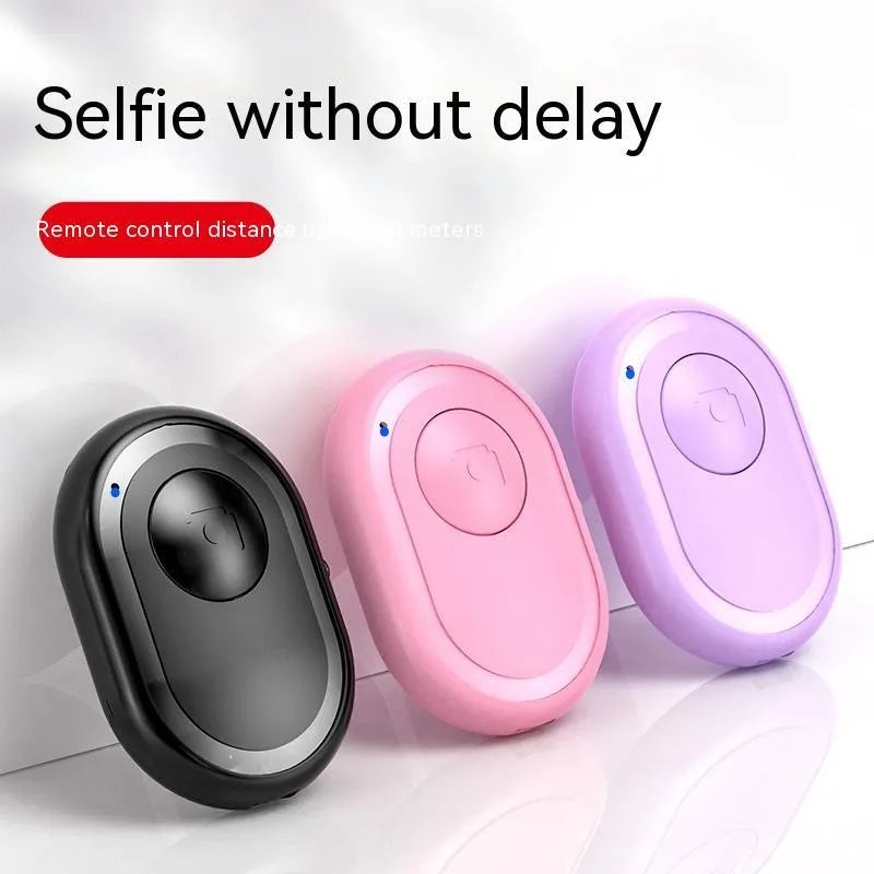 Wireless Bluetooth camera remote control in black, pink and purple colours