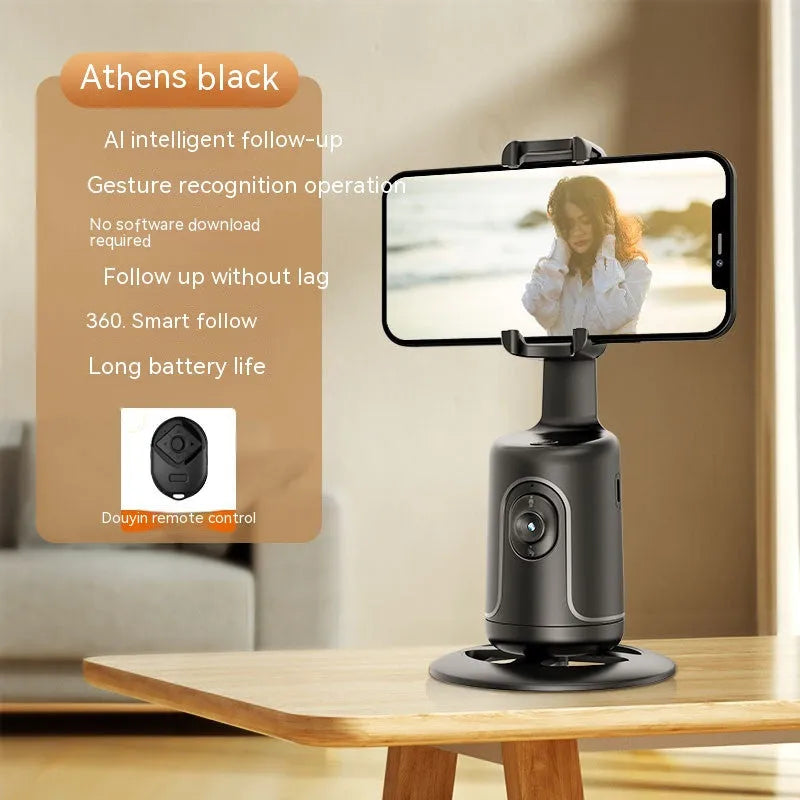 New automatic tracking stabiliser in dark black ABS plastic with 360-degree rotation on a desktop, USB cable attached