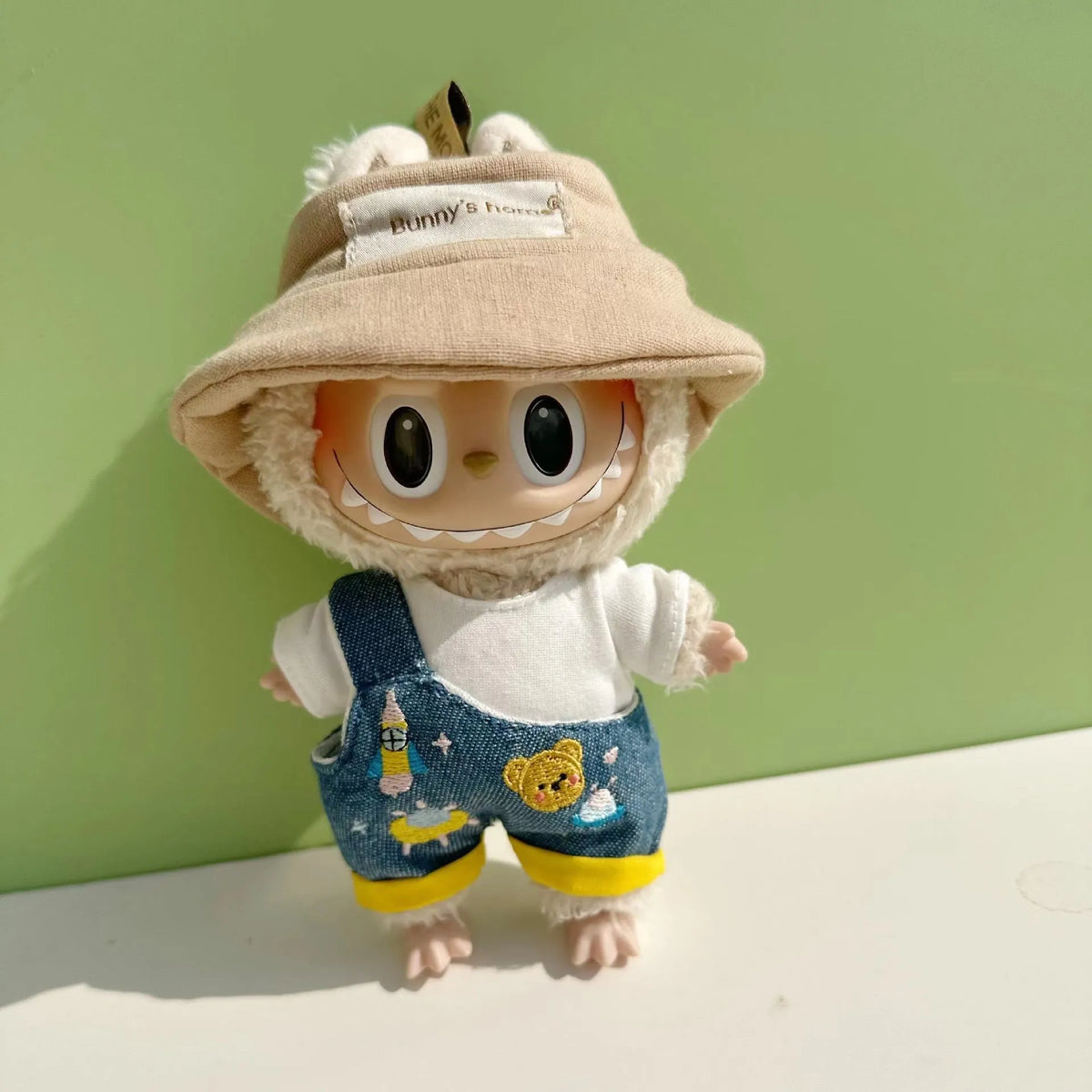 15cm doll clothes pendant in plush fabric, removable and washable, featuring a themed suit design for small dolls