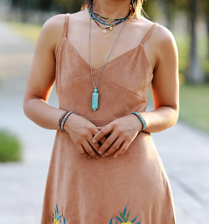 Hand-woven leather bracelet with blue imperial stone accent, geometric design