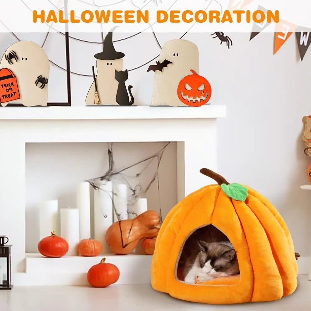 A grey pumpkin-shaped semi-enclosed cat bed with a plush interior, shown on a wooden floor.