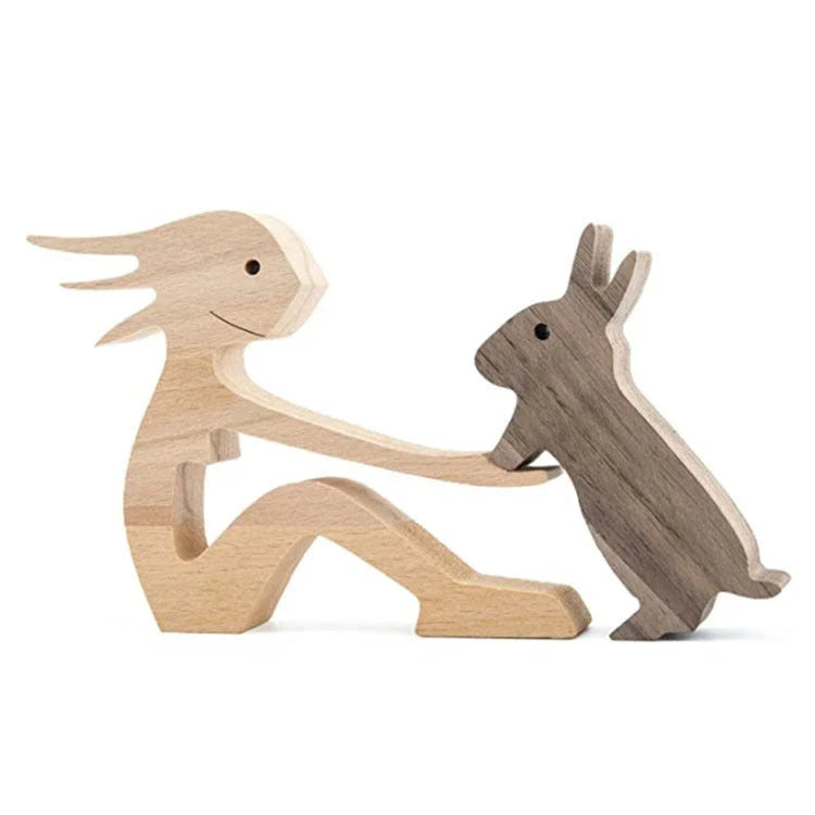 Handcrafted wooden dog sculpture featuring a man and his loyal canine companion