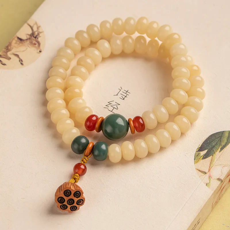 Wooden Bodhi root bracelet with flat round 6x9mm beads in milk butter colour
