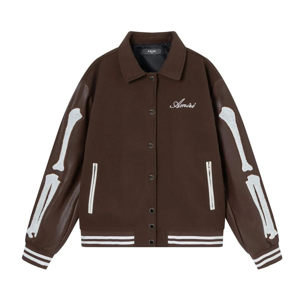 Women's apricot jacket with bone embroidery detail on the front, shown on a hanger.