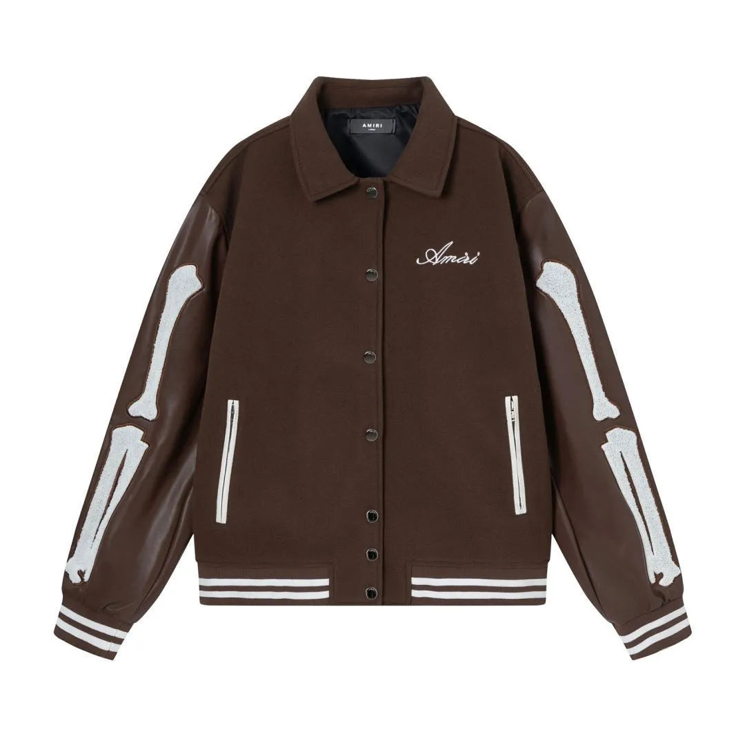 Women's apricot jacket with bone embroidery detail on the front, shown on a hanger.
