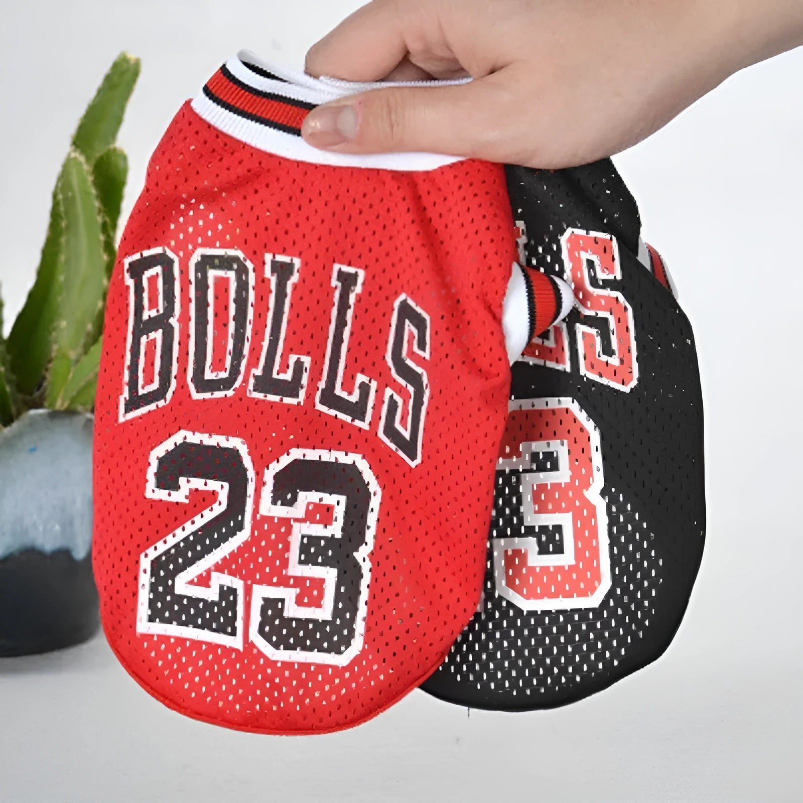 Casual black and red polyester dog sweatshirt vests shown in sizes from small to extra-extra large.