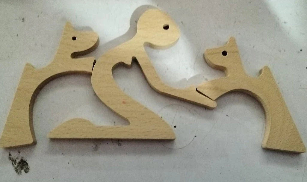 Handcrafted wooden dog sculpture featuring a man and his loyal canine companion