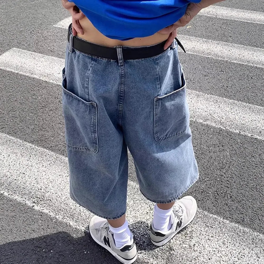 Blue high-waisted men's denim pirate shorts with a cropped length and straight-leg silhouette on a white background.