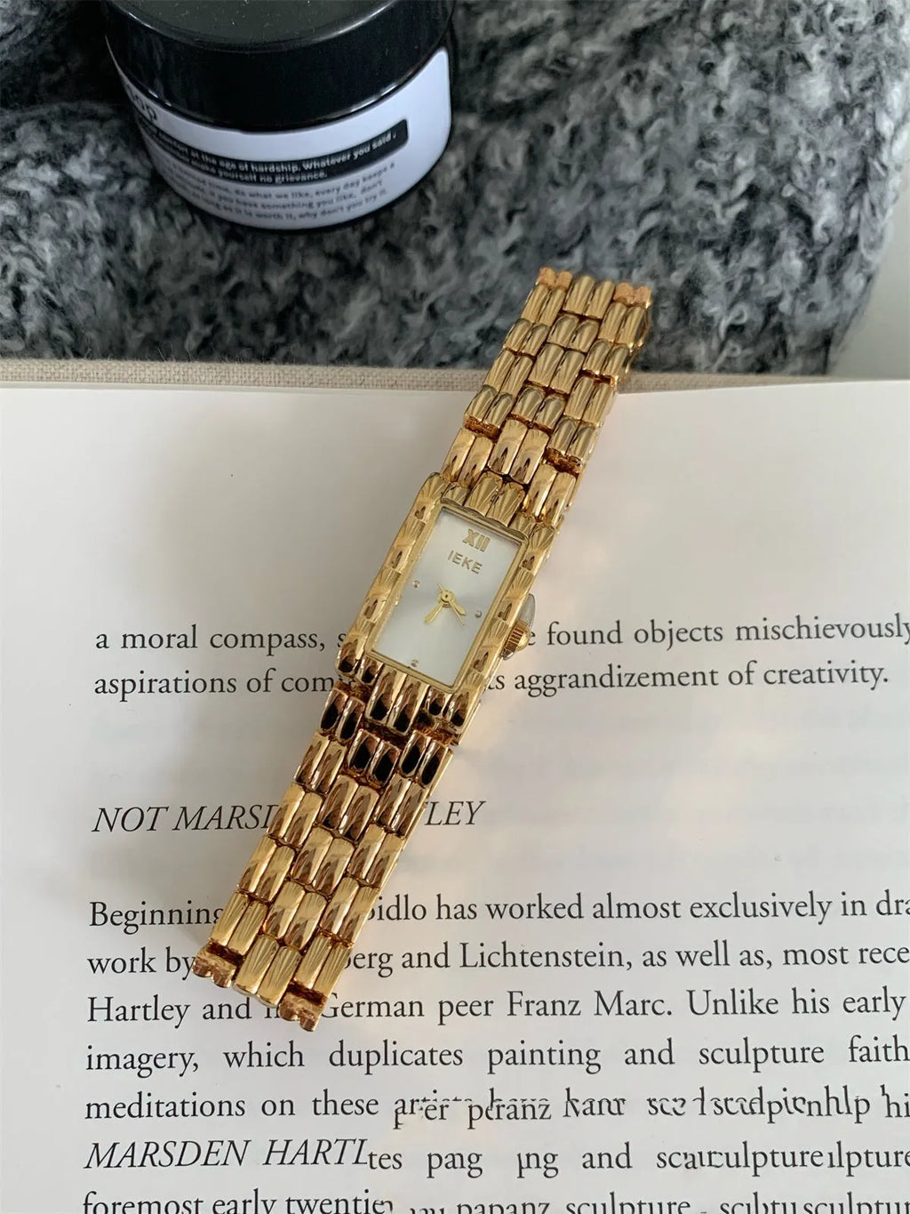 A bracelet-style ladies' watch with a stainless steel case, showing a choice of silver or gold finishes with white or grey dials.