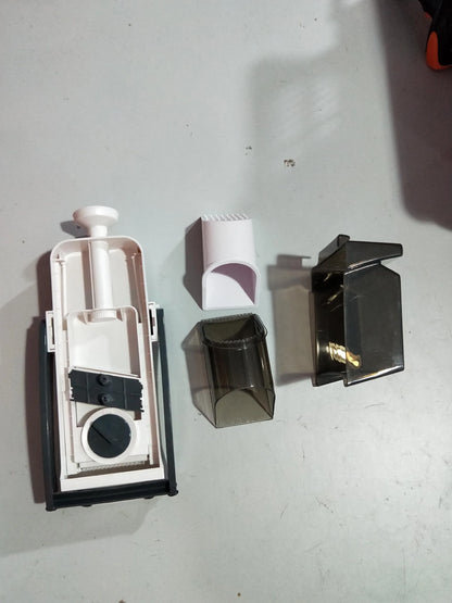 Multifunctional vegetable cutter with safety blade guard and multiple slicing options