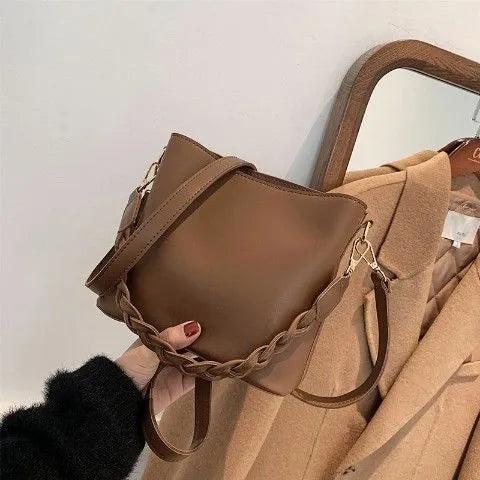 Retro woven PU one-shoulder crossbody underarm bucket bag in khaki colour.