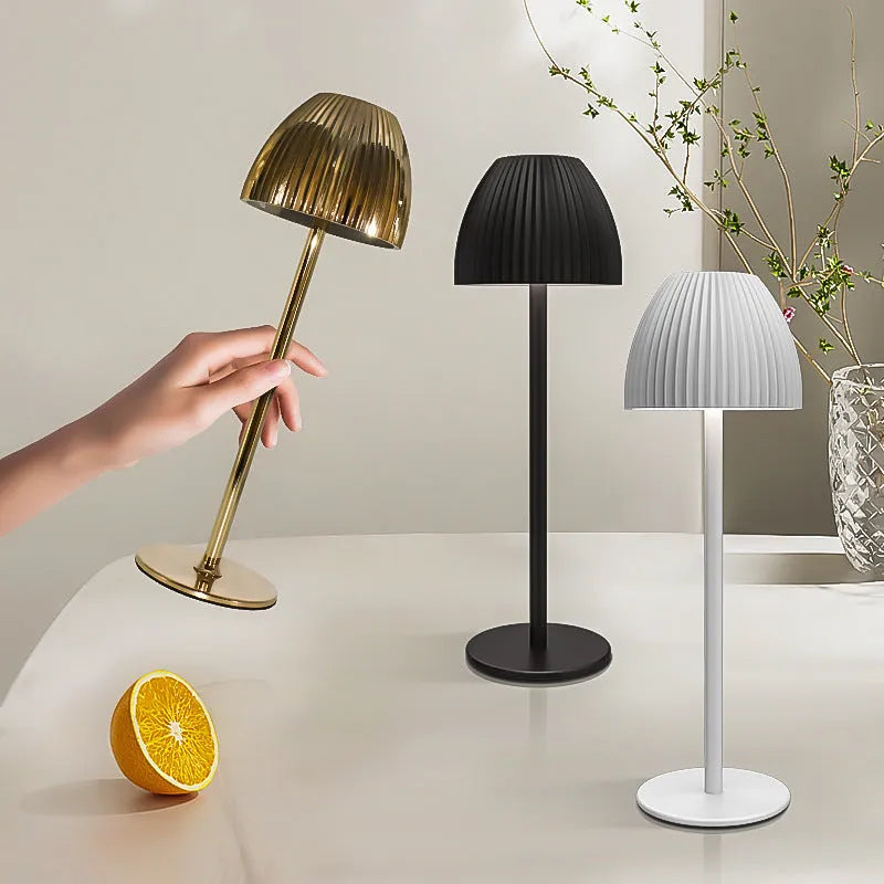 Small modern table lamp with dimming function on thin round base in black finish