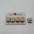 Wooden date night dice game set showing five dice, a rectangular wooden board, and a black fabric storage bag.
