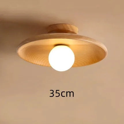 Solid wood ceiling lamp with glass shade in minimalist circular design