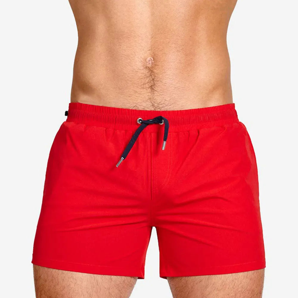 Polyester sports shorts with mesh lining in multiple colours including army green and rose red.