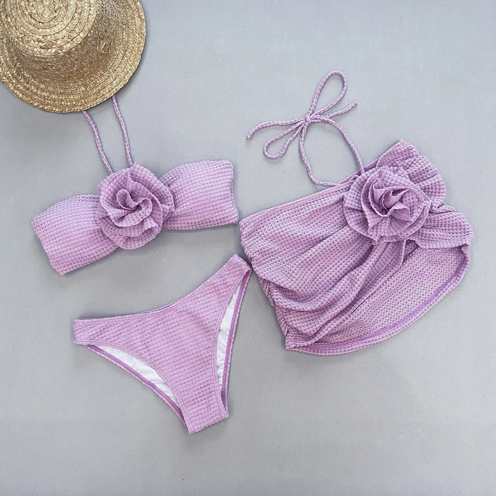 Women's white three-piece bikini set with 3D flower split detail on the briefs