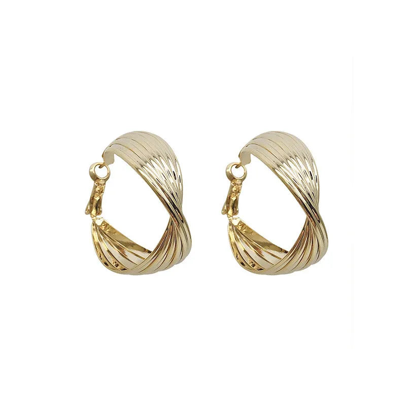 Twisted metal eardrop earring with real gold plating, round geometric shape, gold colour, drop style for women