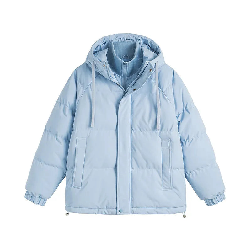 Loose beige winter cotton-padded coat with side pockets on a hanger