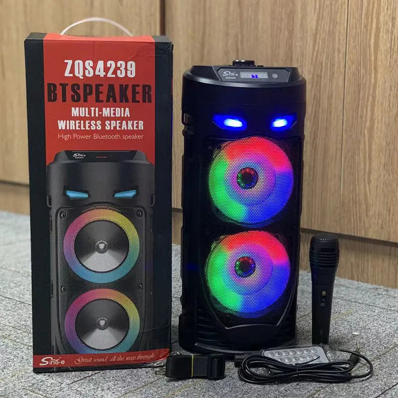 Black portable Bluetooth speaker with dual horn cannon design showing USB charging port and compact dimensions