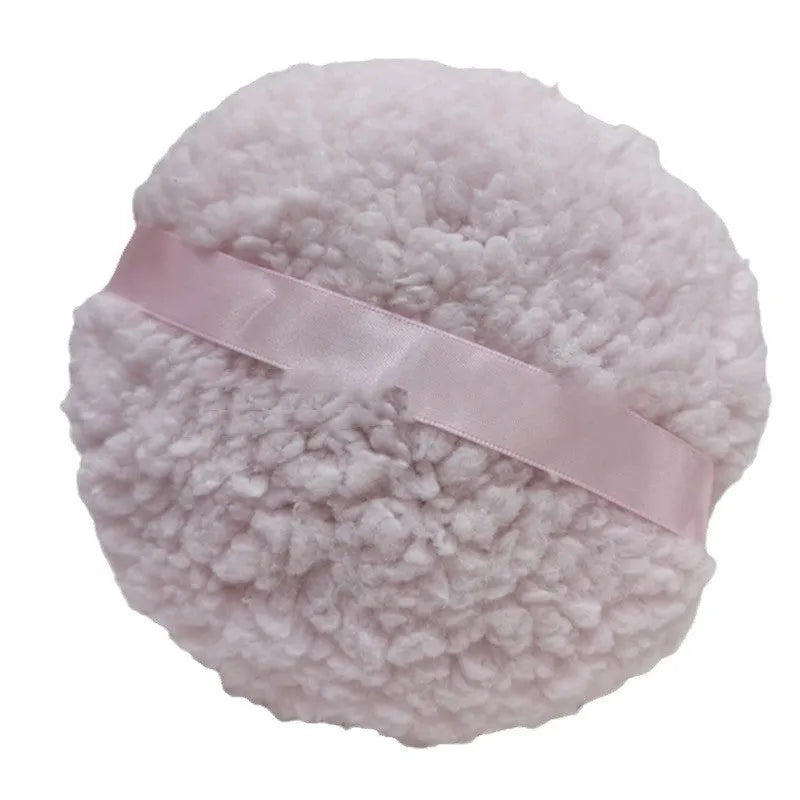 Oversized rectangular plush powder puff for dry makeup application on a white background.