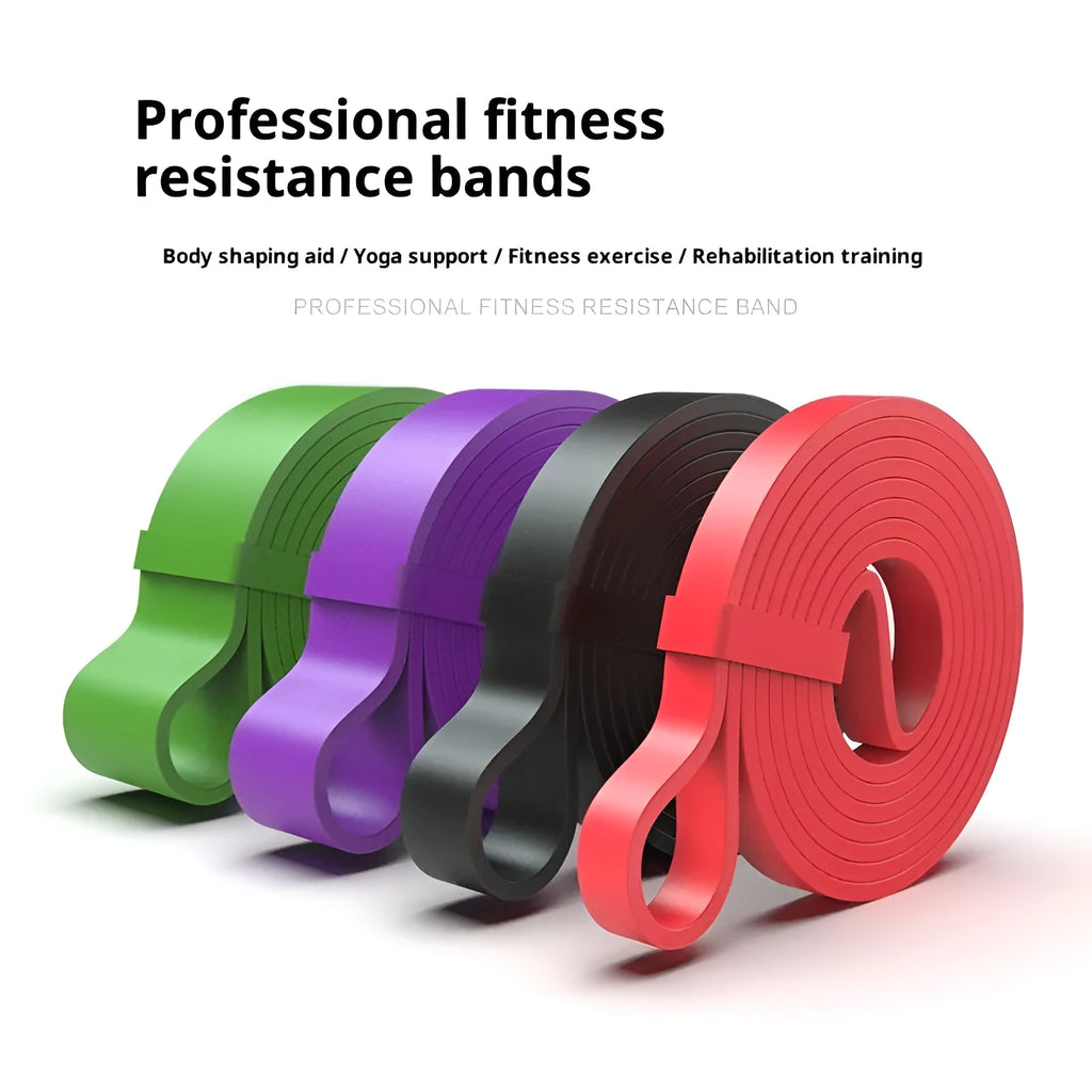 Set of five TPE resistance bands in yellow, red, black, purple, and green on a wooden floor