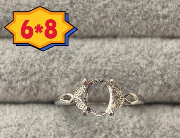 Oval denier ring with open mouth design showing 6*8mm main stone and five-pointed star decoration