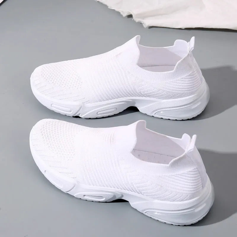 Slip-on breathable sock shoe in a low-top design with a mesh upper and PVC sole.
