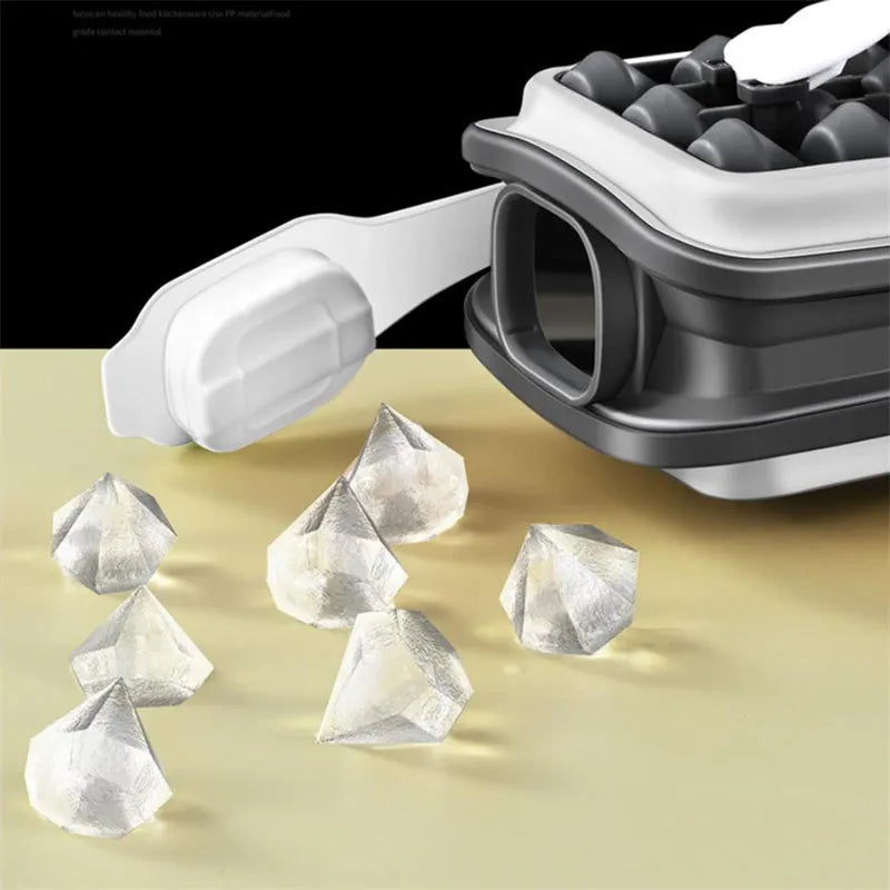 Silicone ice ball mould bottle in light grey, showing integrated ice tray and bottle with lid.