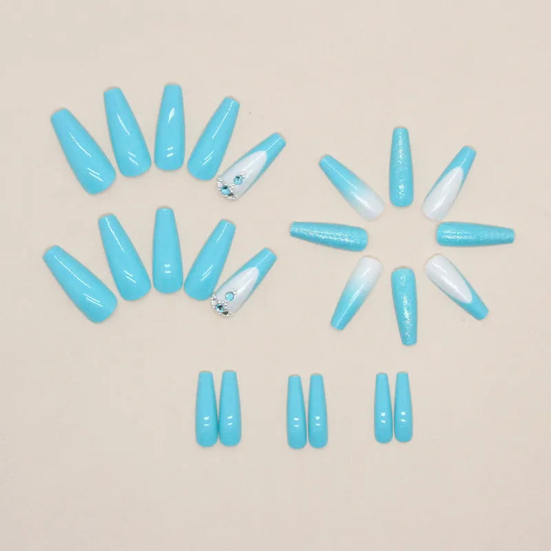Solid colour artificial nails with smart blue diamond accents and ballet-length cut