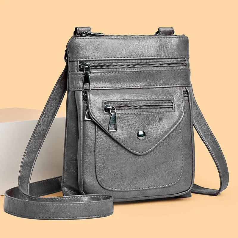 Women's vertical crossbody mobile phone bag in PU material with shoulder strap