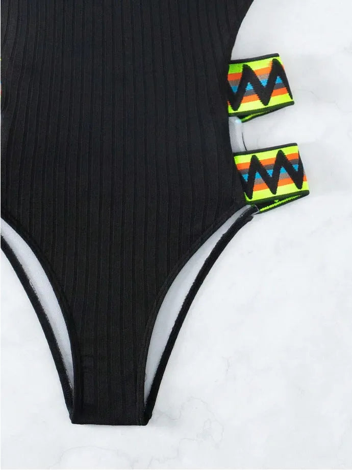 Women's solid colour one-piece swimsuit in black or orange