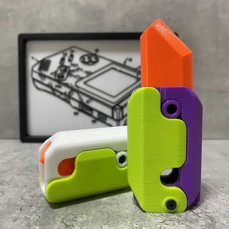 3D printed carrot gravity fidget knife in orange purple green colour, showing blade partly extended from sheath