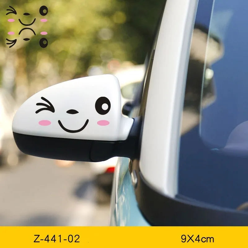 Pair of reflective cartoon eyes car stickers on a vehicle rearview mirror