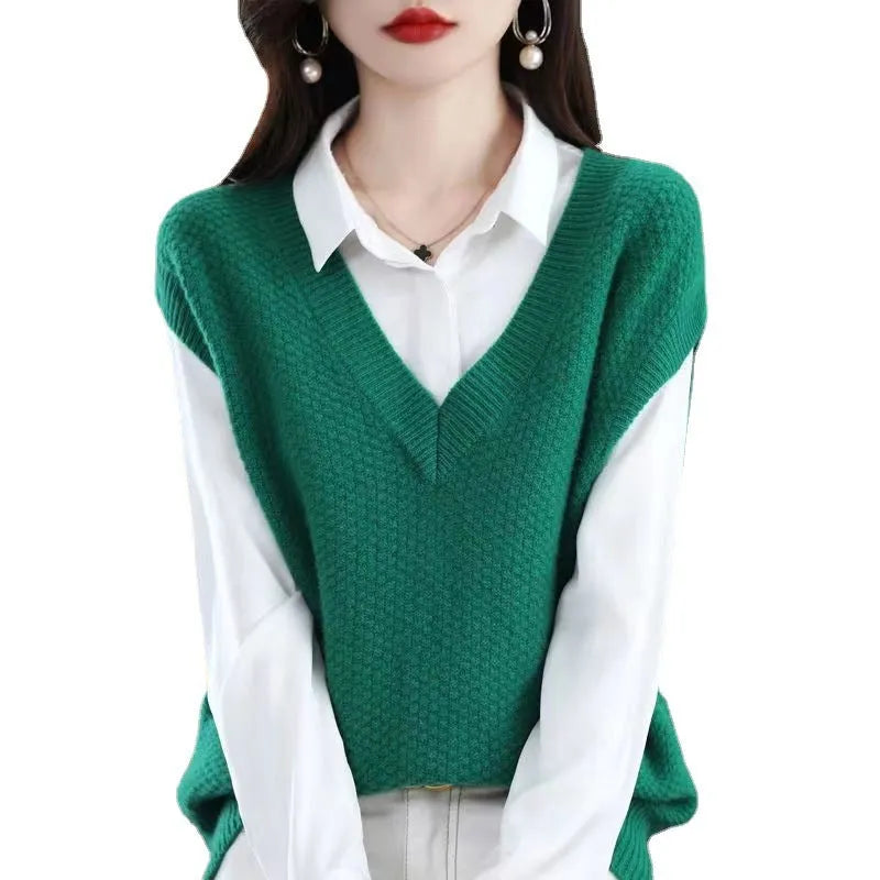 Women's creamy-white sleeveless cashmere-knit vest with a raised 3D pattern, shown as a pullover.