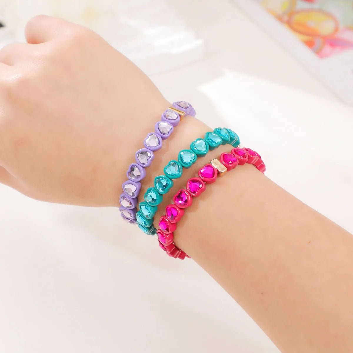 Rainbow enamel alloy heart stretch bracelet showing colourful pattern and heart charm