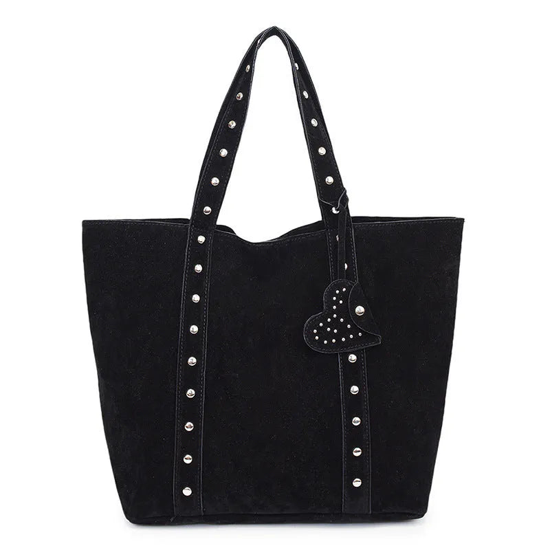 Black PU leather tote bag with double shoulder straps, showing interior sandwich pocket organiser.