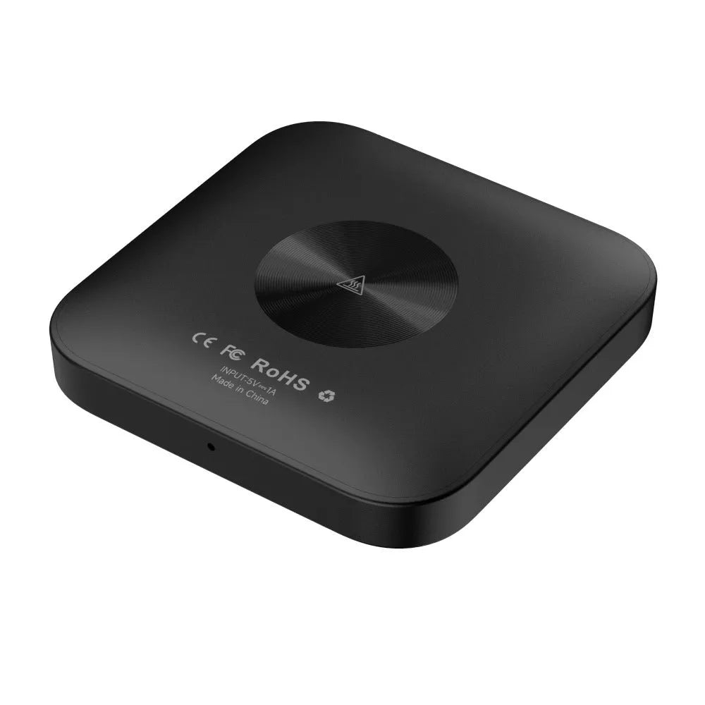 Compact square wireless CarPlay adapter box for cars with factory wired CarPlay systems.