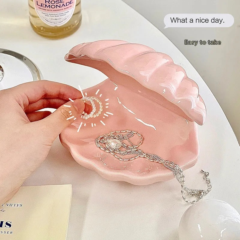 Yellow porcelain ornamental tray with optional night light, shown with white and pink shell options.
