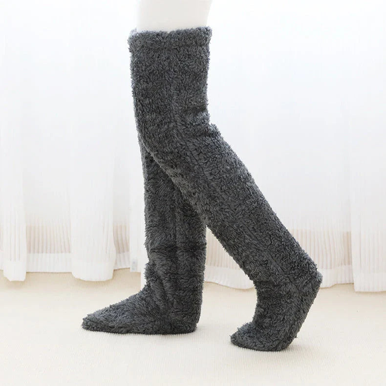 Cozy over-the-knee fuzzy socks in various colors, designed to keep your legs and knees warm during the winter season.