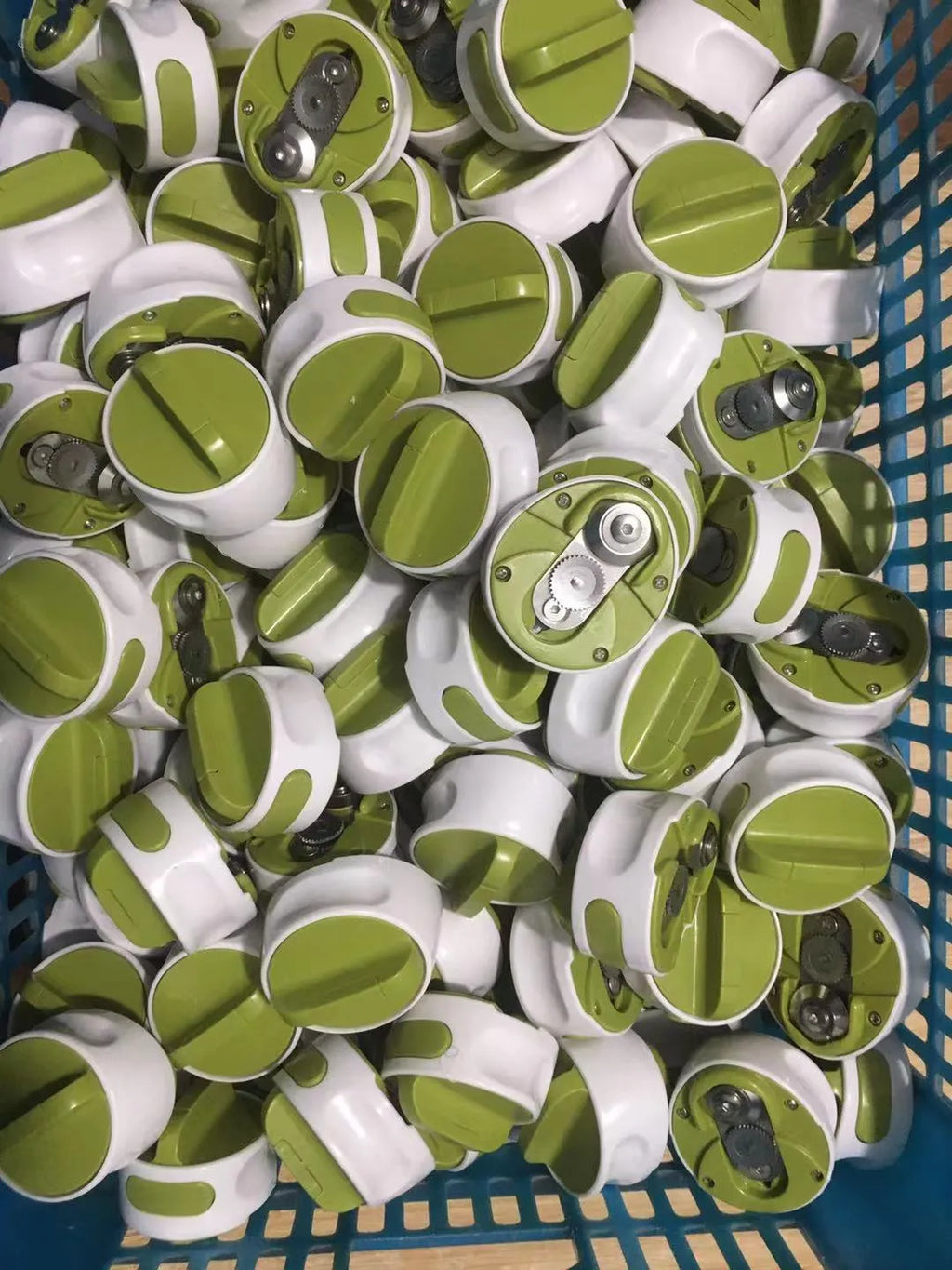 Stainless steel bottle opener with lever mechanism in green colour
